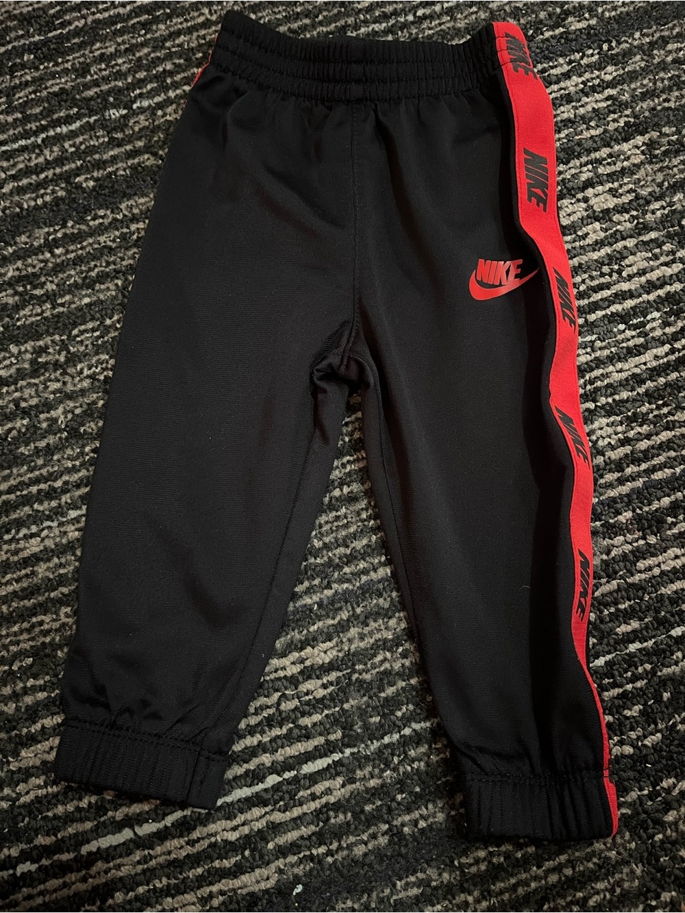 Nike Black Joggers with Red Logo and Side Tape